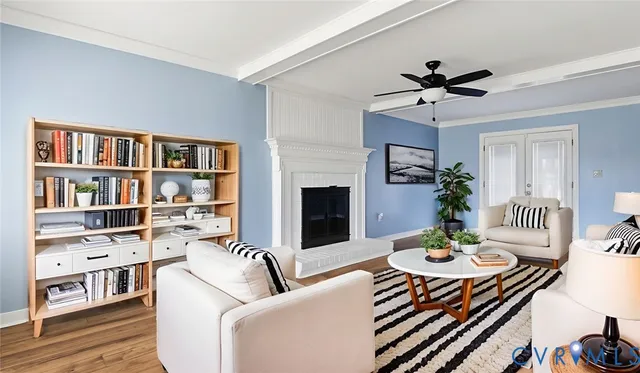 a living room with furniture and a bookshelf