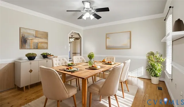 a dining room with furniture and wooden floor