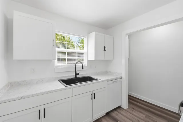 a kitchen with a sink and cabinets