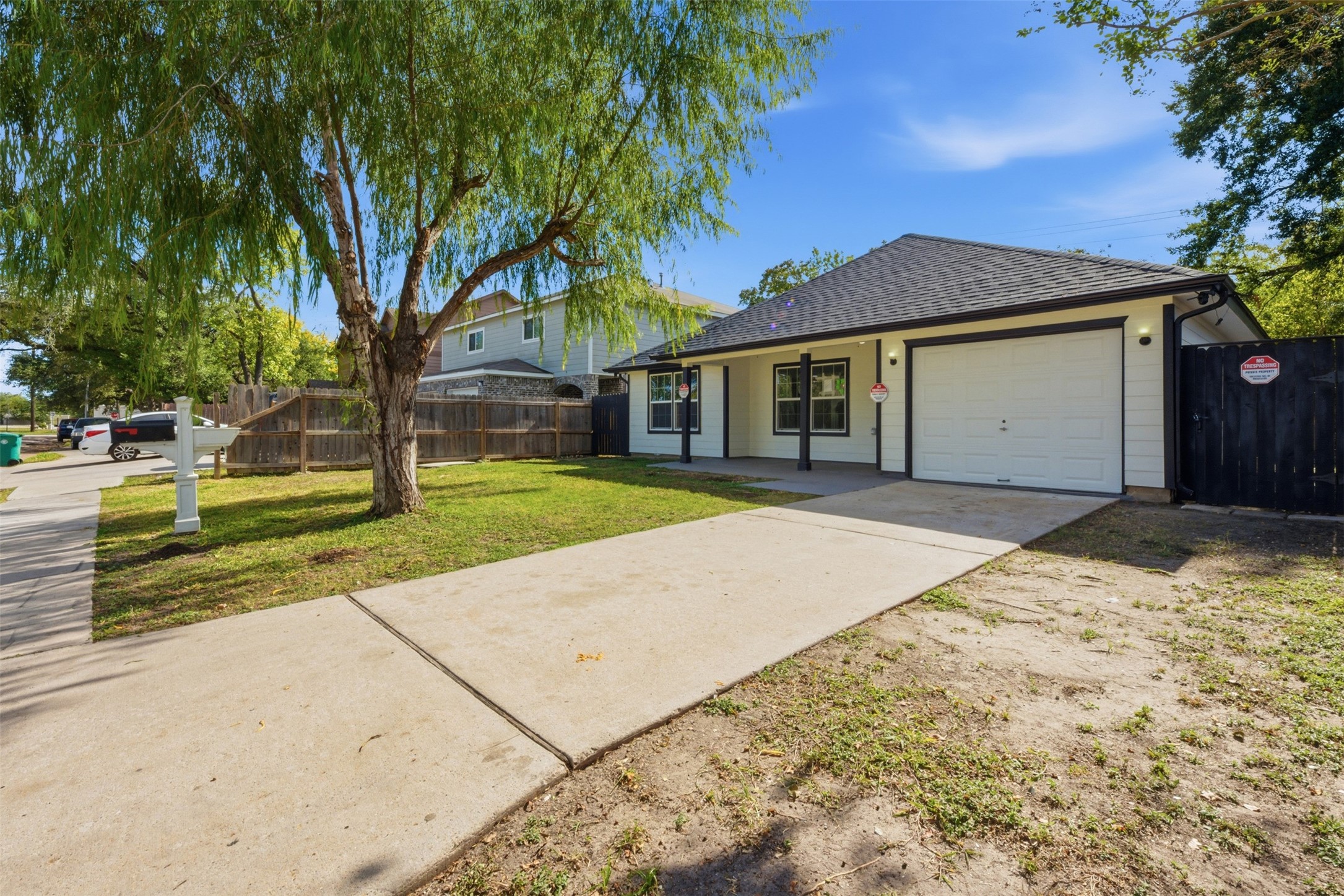 111 Calvin Street Pasadena, TX 77506 - Photo 32 of 40 a front view of a house with a yard and garage