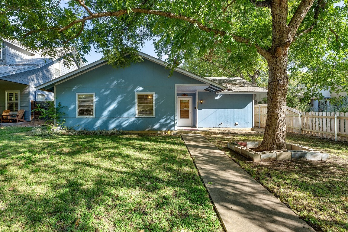 a backyard of a house with seating space