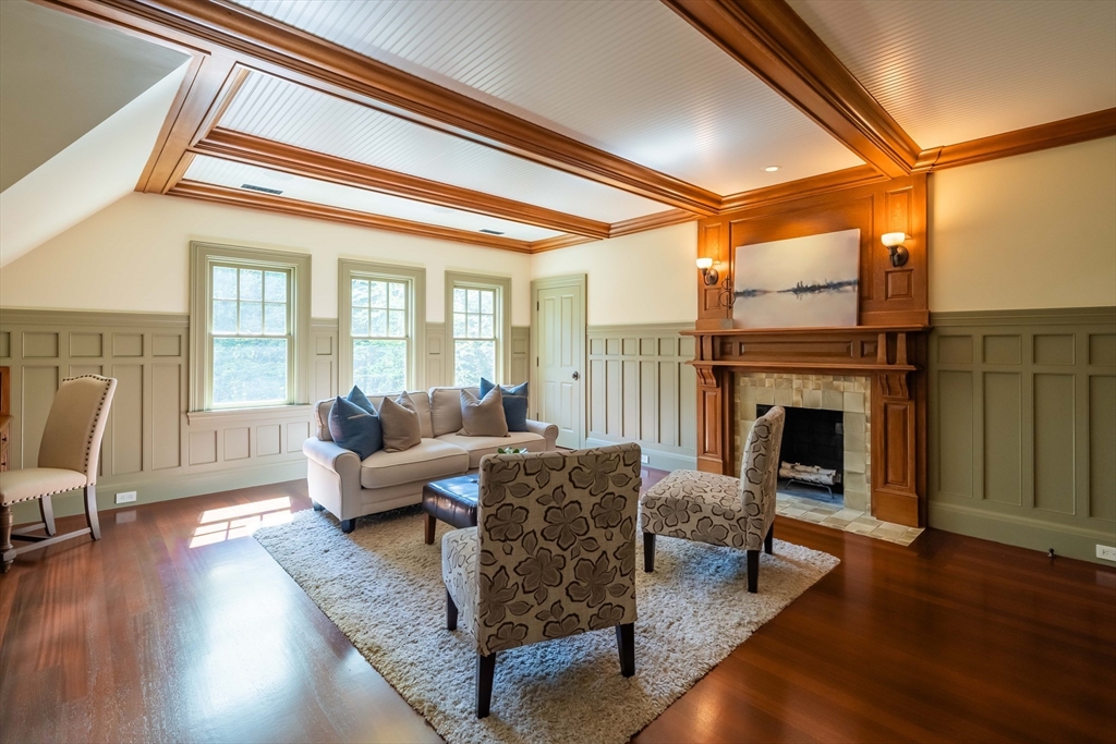 197 Grant Street Lexington, MA 02420 - Photo 29 of 42 a living room with furniture a fireplace and wooden floor