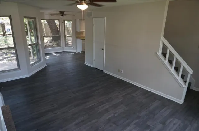 a view of an entryway with wooden floor