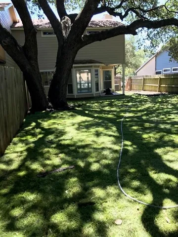 a backyard of a house with lots of green space