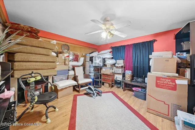 a living room with furniture and a piano