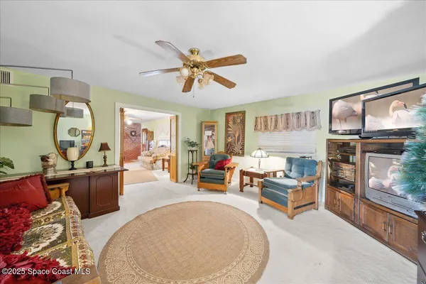 a kitchen with cabinets appliances and a dining table