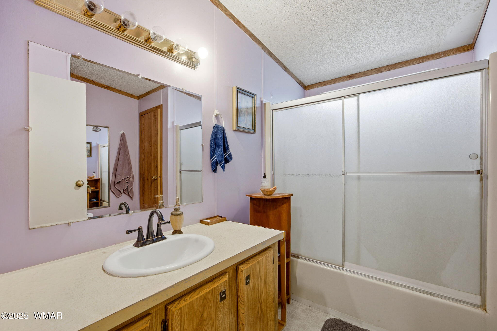 703 East Frontier Street, Unit 31 Payson, AZ 85541 - Photo 11 of 21 a bathroom with a sink and a mirror