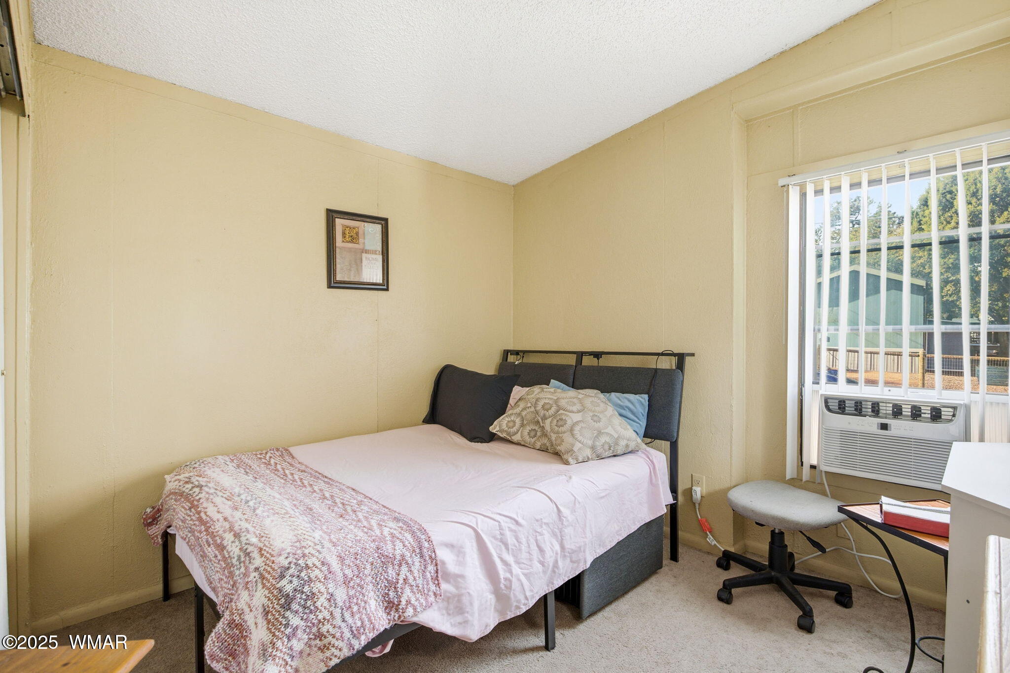 703 East Frontier Street, Unit 31 Payson, AZ 85541 - Photo 14 of 21 a bedroom with a bed and a window