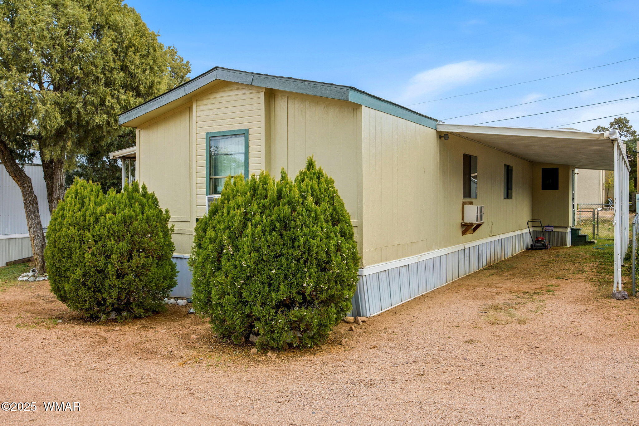 703 East Frontier Street, Unit 31 Payson, AZ 85541 - Photo 3 of 21 a front view of a house with garden