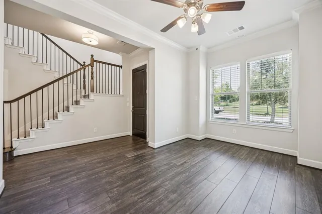 a view of an entryway with wooden floor