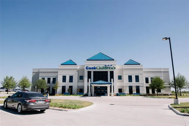 a front view of a building with street view
