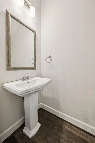 a bathroom with a sink and mirror