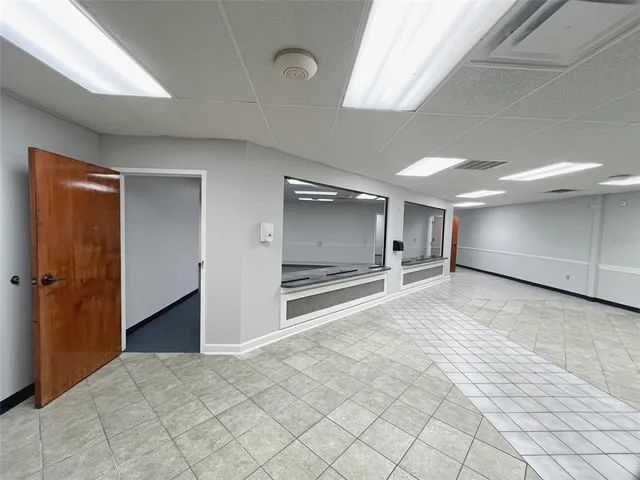 a view of an empty room and a window