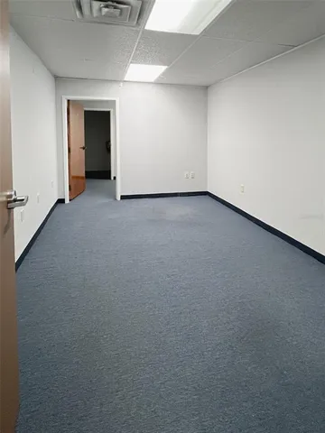 a view of an empty room and closet