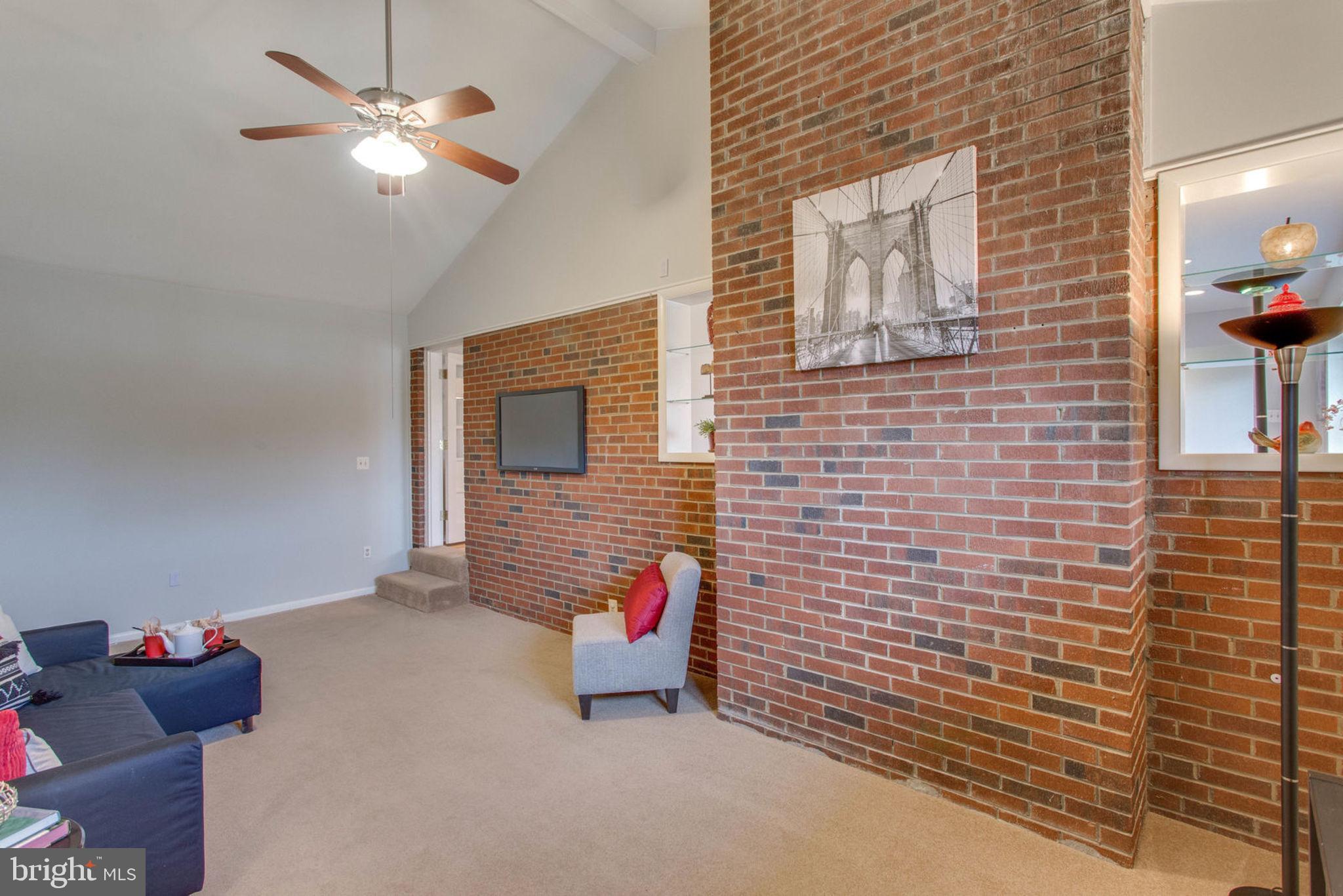 6808 Hackberry Street Springfield, VA 22150 - Photo 29 of 50 Peek through to the living room.