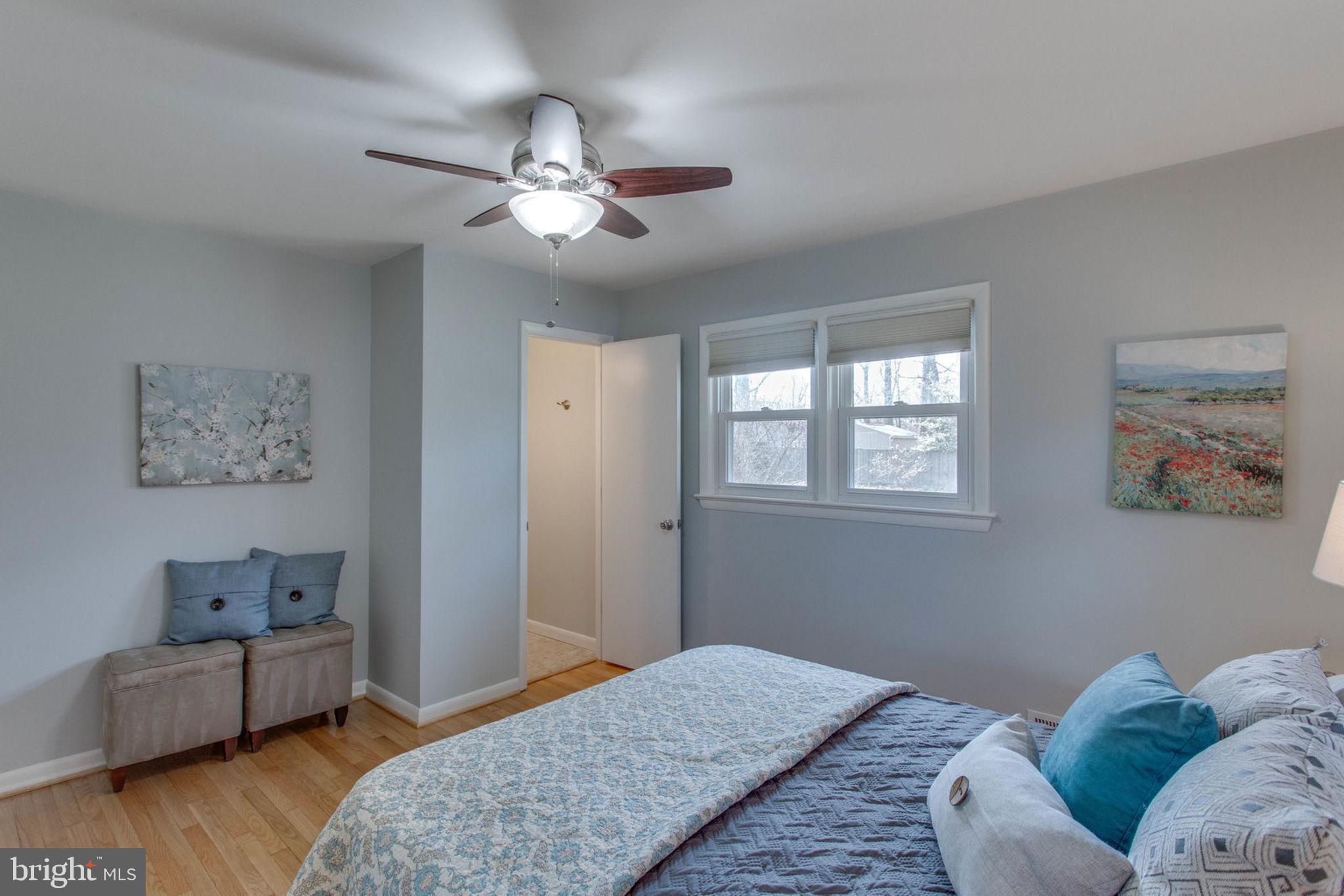 6808 Hackberry Street Springfield, VA 22150 - Photo 36 of 50 The master bedroom looks out to the sunny yard