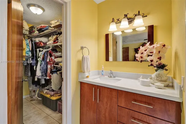 a view of a bathroom sink and mirror