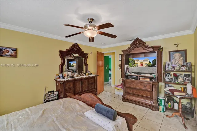 a bedroom with furniture and a chandelier