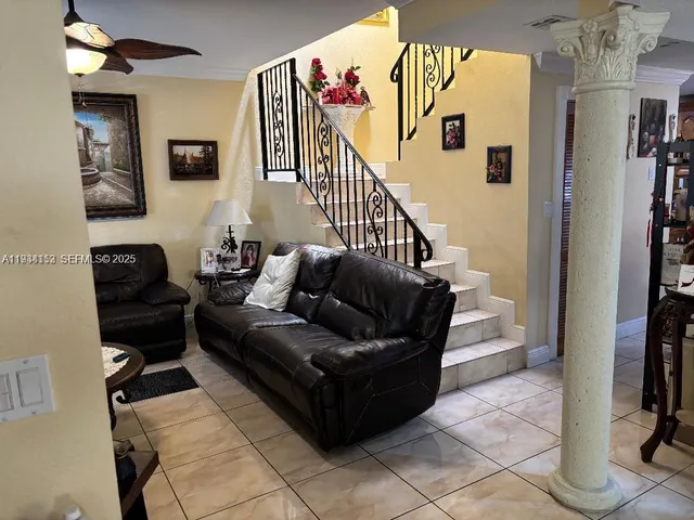 a living room with furniture and a window