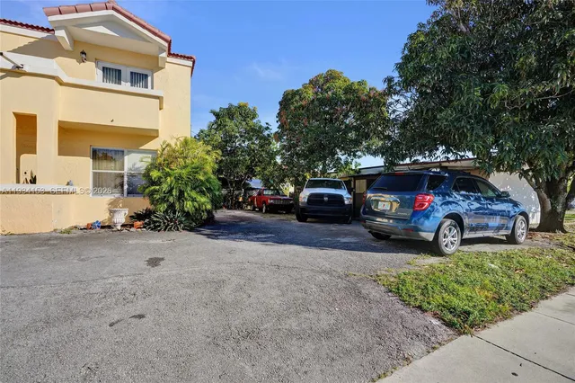 a view of a car parked in front of a house