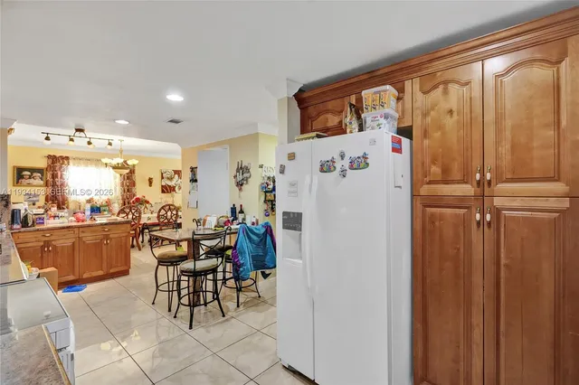 a dining room with furniture and a window