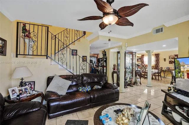 a living room with furniture and a window
