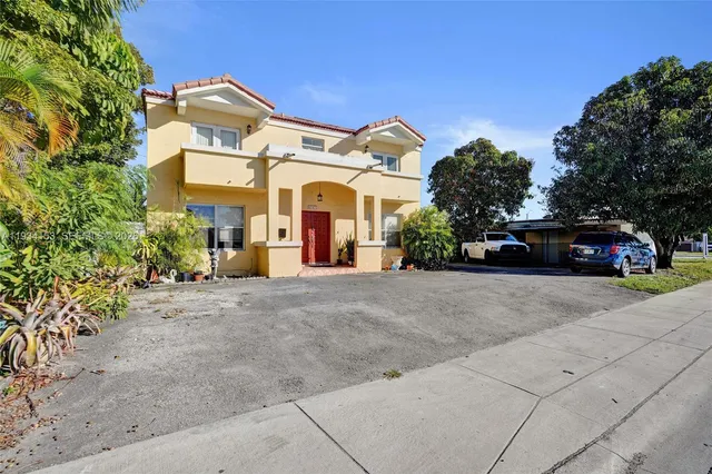 a view of a car parked on the side of a road