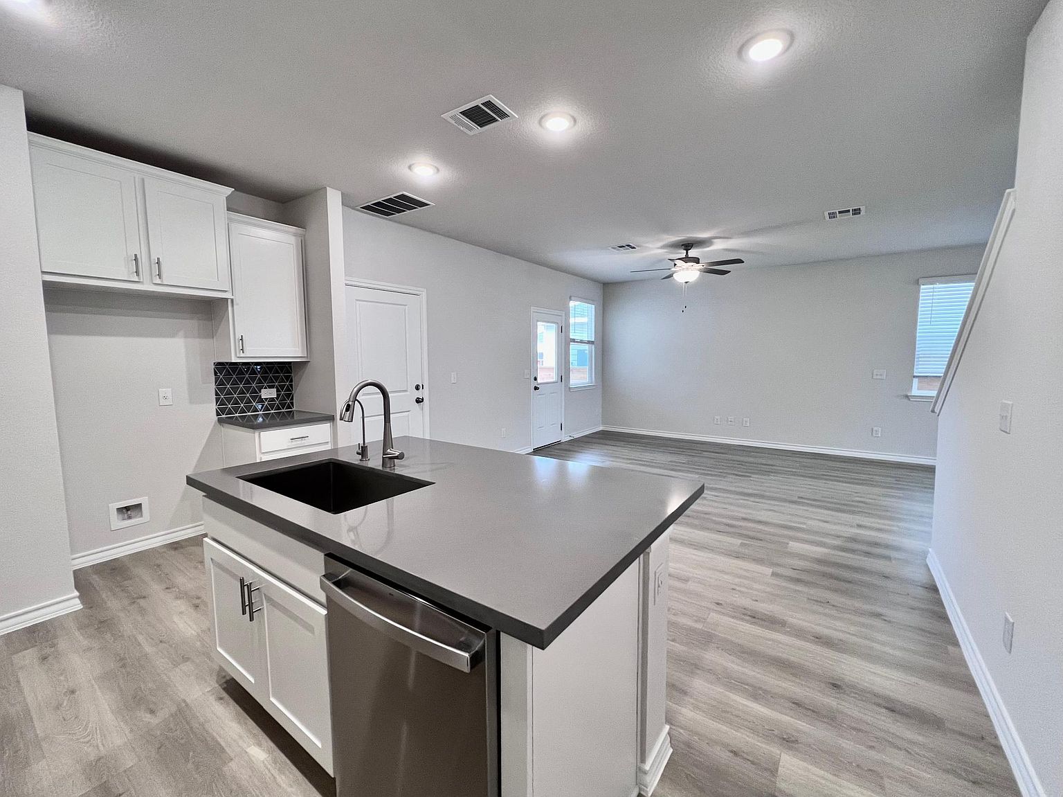 4701 Lavender Field Path, Unit 186 Austin, TX 78723 - Photo 12 of 29 a kitchen that has a sink and a stove in it