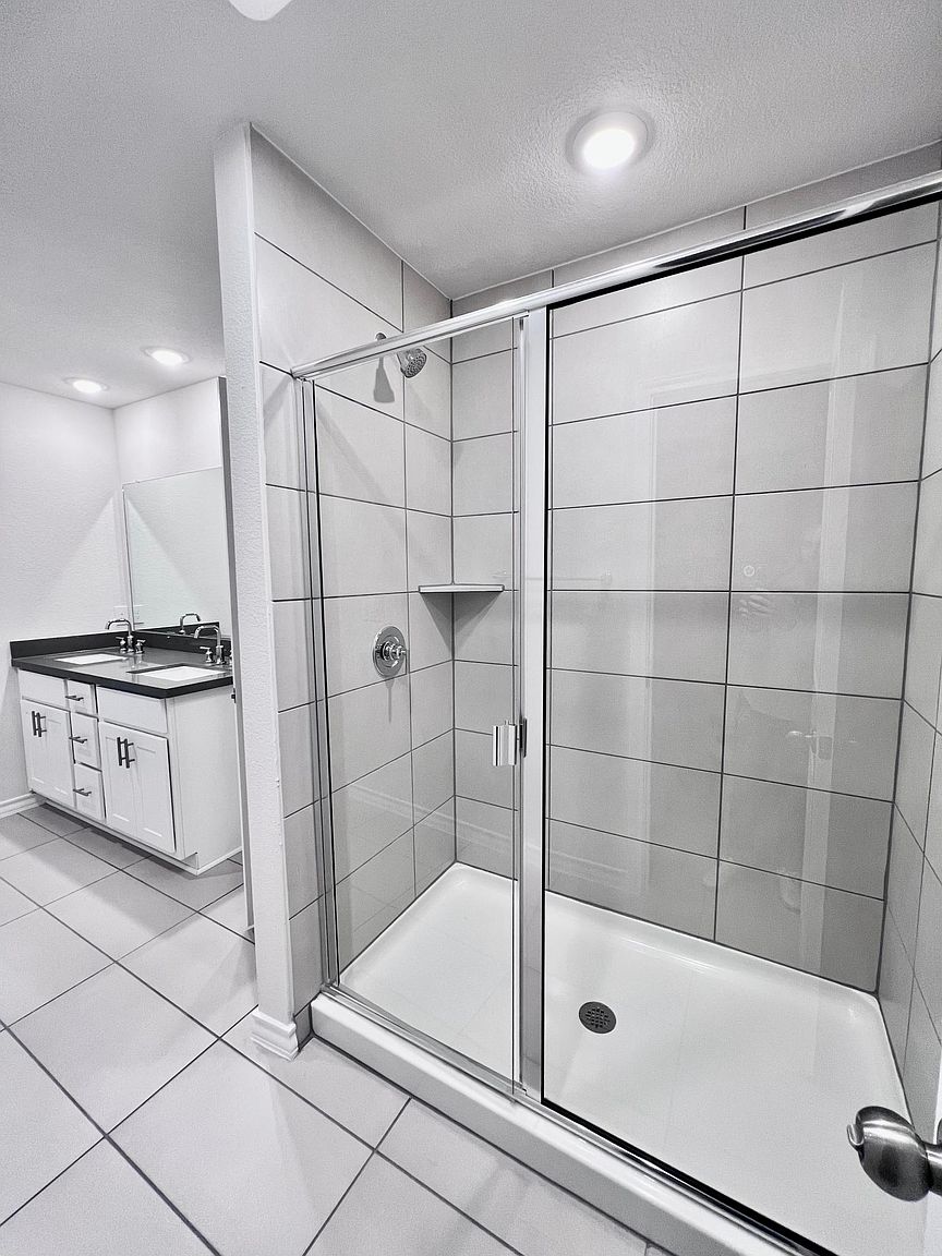 4701 Lavender Field Path, Unit 186 Austin, TX 78723 - Photo 17 of 29 a bathroom with a bathtub and a shower