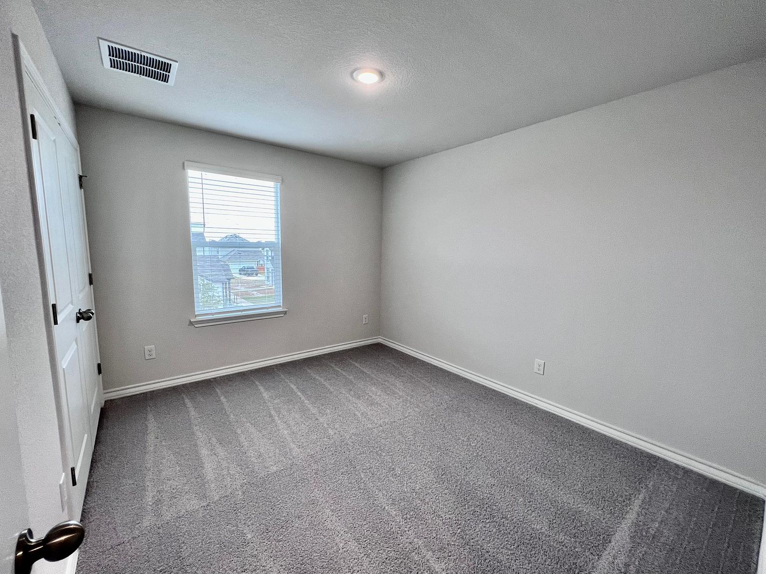 4701 Lavender Field Path, Unit 186 Austin, TX 78723 - Photo 21 of 29 an empty room with windows