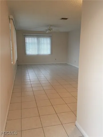 a view of an empty room and window