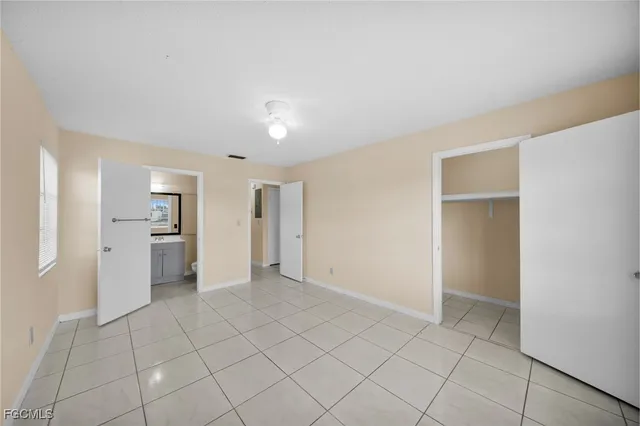a view of a kitchen with a sink and a refrigerator