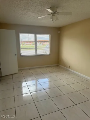 a view of an empty room and a window
