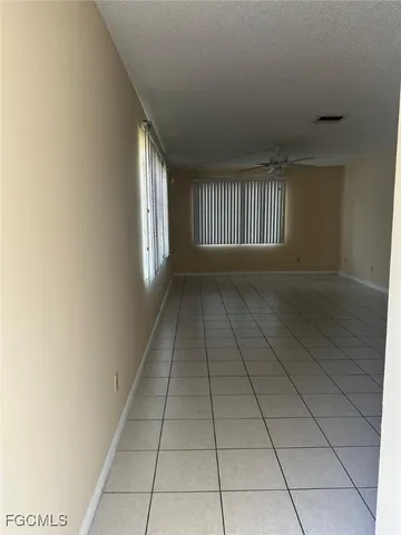 a view of empty room with windows