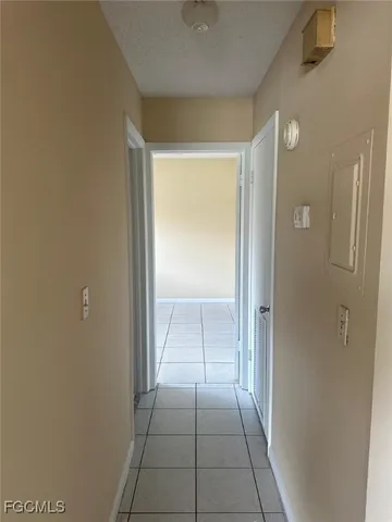 a view of a hallway to rooms