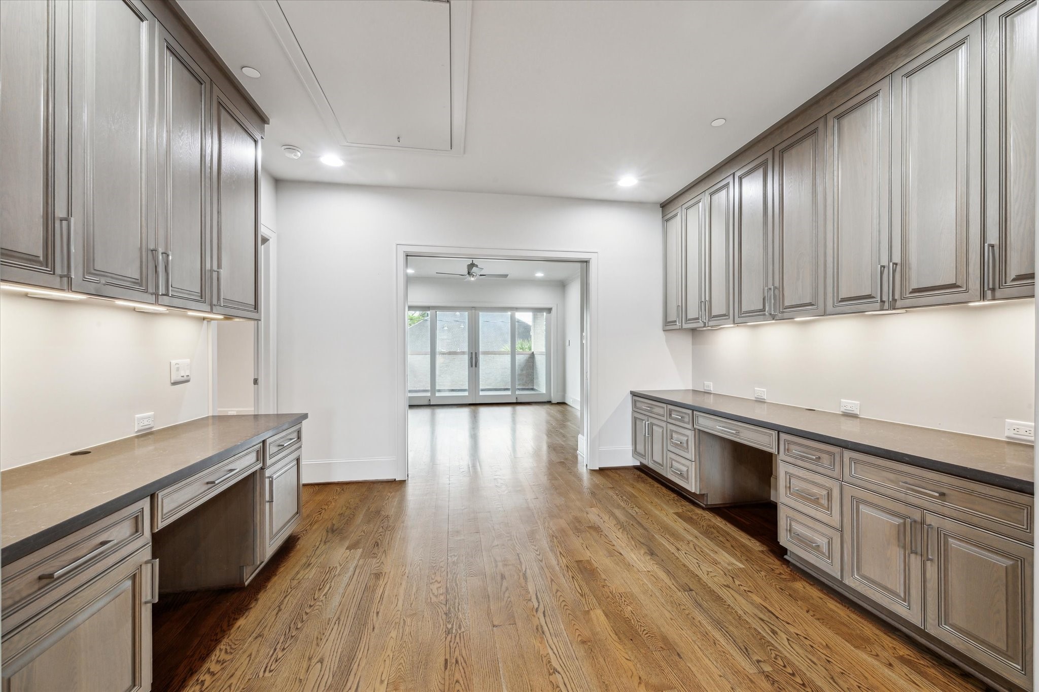 4615 Verone Street Bellaire, TX 77401 - Photo 27 of 43 The home workstation opens seamlessly to the game room, offering a perfect balance of productivity and play. Ideal for studying, remote work, or creative projects, this space keeps you connected while providing a dedicated area for focus and organization.
2/2