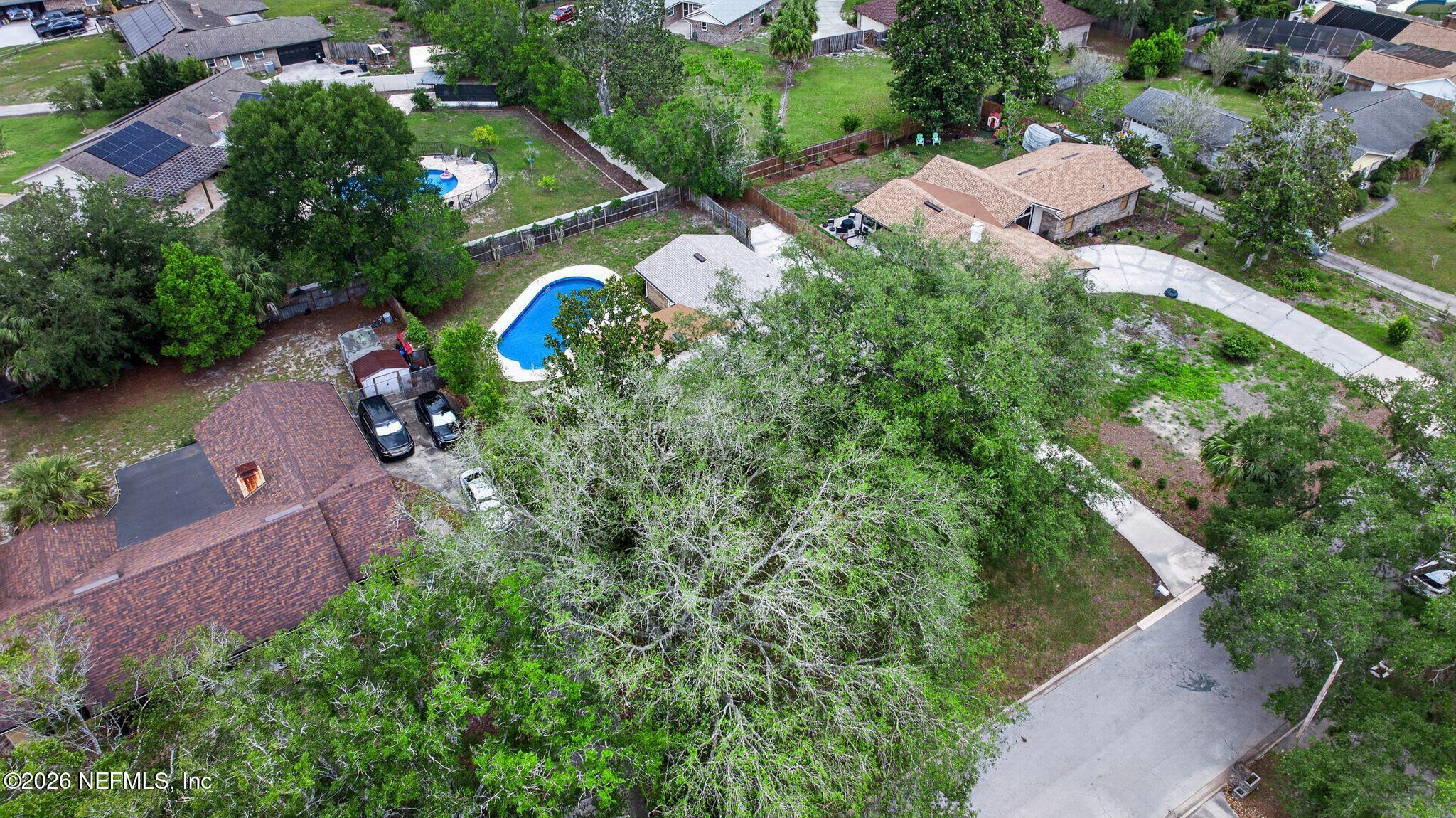 138 Ridgefield Court Orange Park, FL 32065 - Photo 58 of 64 an aerial view of house with yard swimming pool and outdoor seating