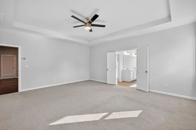 a sign that is sitting in front of flowers