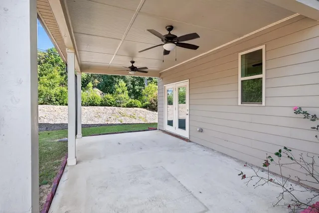 a view of a house with a backyard
