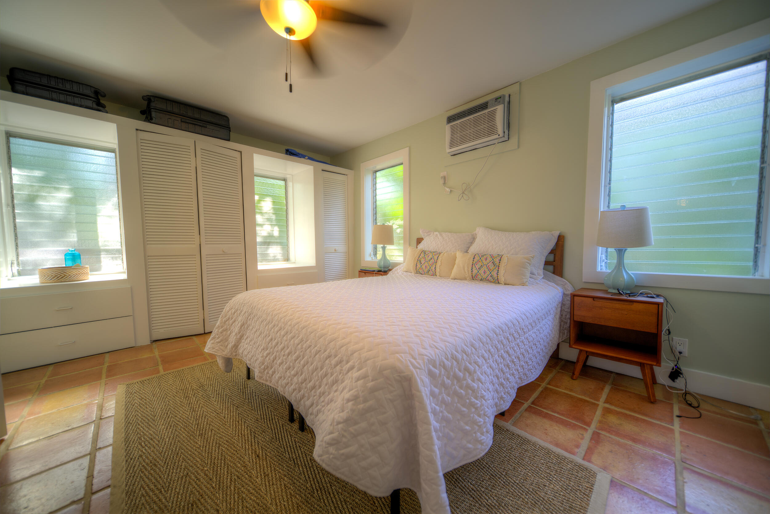 1317 Newton Street Key West, FL 33040 - Photo 11 of 19 a bedroom with a bed and a chandelier