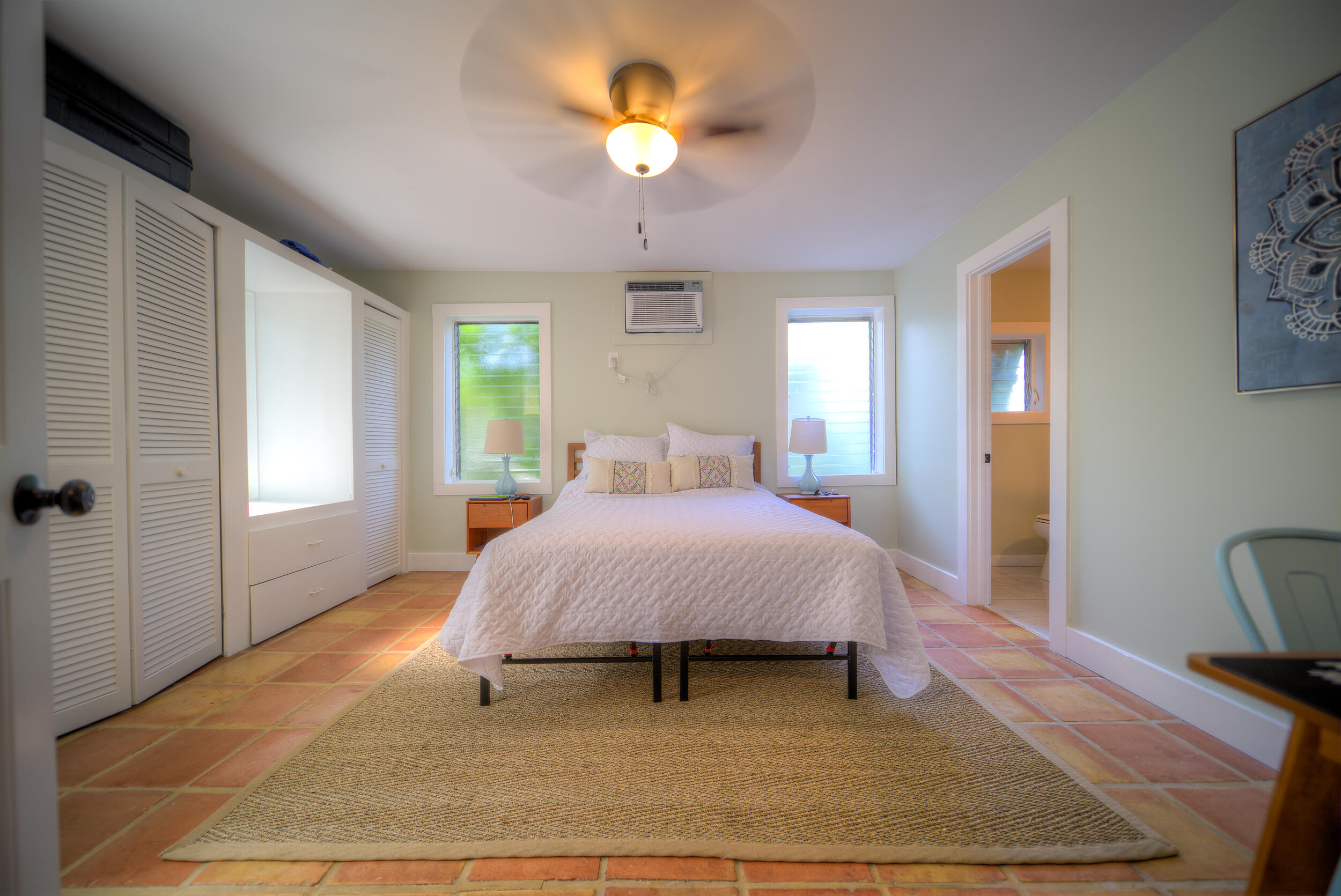 1317 Newton Street Key West, FL 33040 - Photo 10 of 19 a bedroom with a bed and a chandelier
