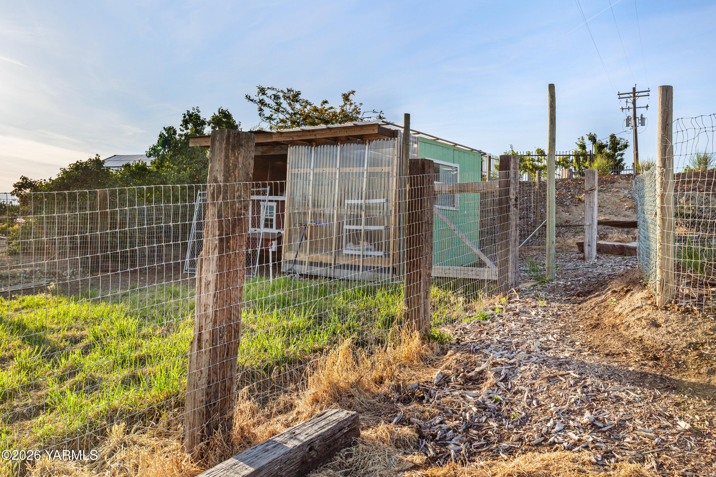 5060 Lombard Loop Road Zillah, WA 98953 - Photo 60 of 65 a view of a house with a yard and potted plants