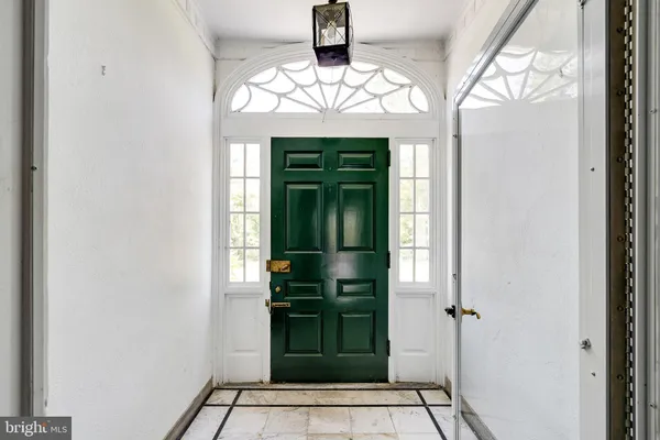 an empty room with wooden floor and fireplace