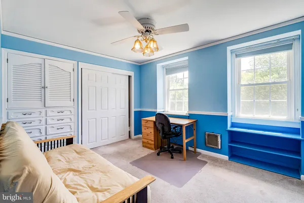 a view of an empty room with a large window