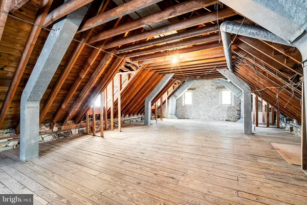 a view of empty room with wooden walls