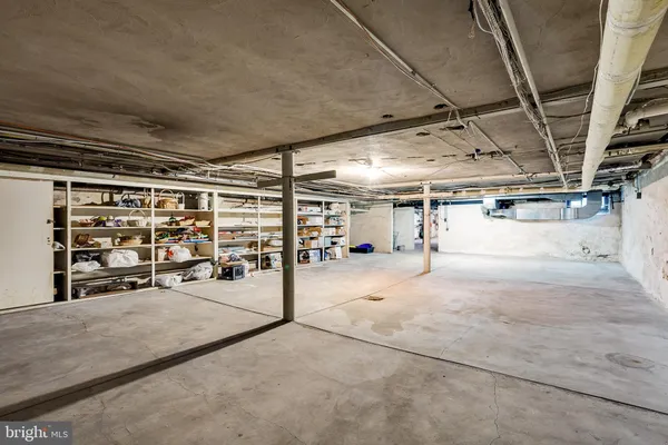 a view of green field with trees in the background