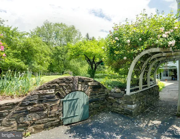 a view of a house with a yard and plants