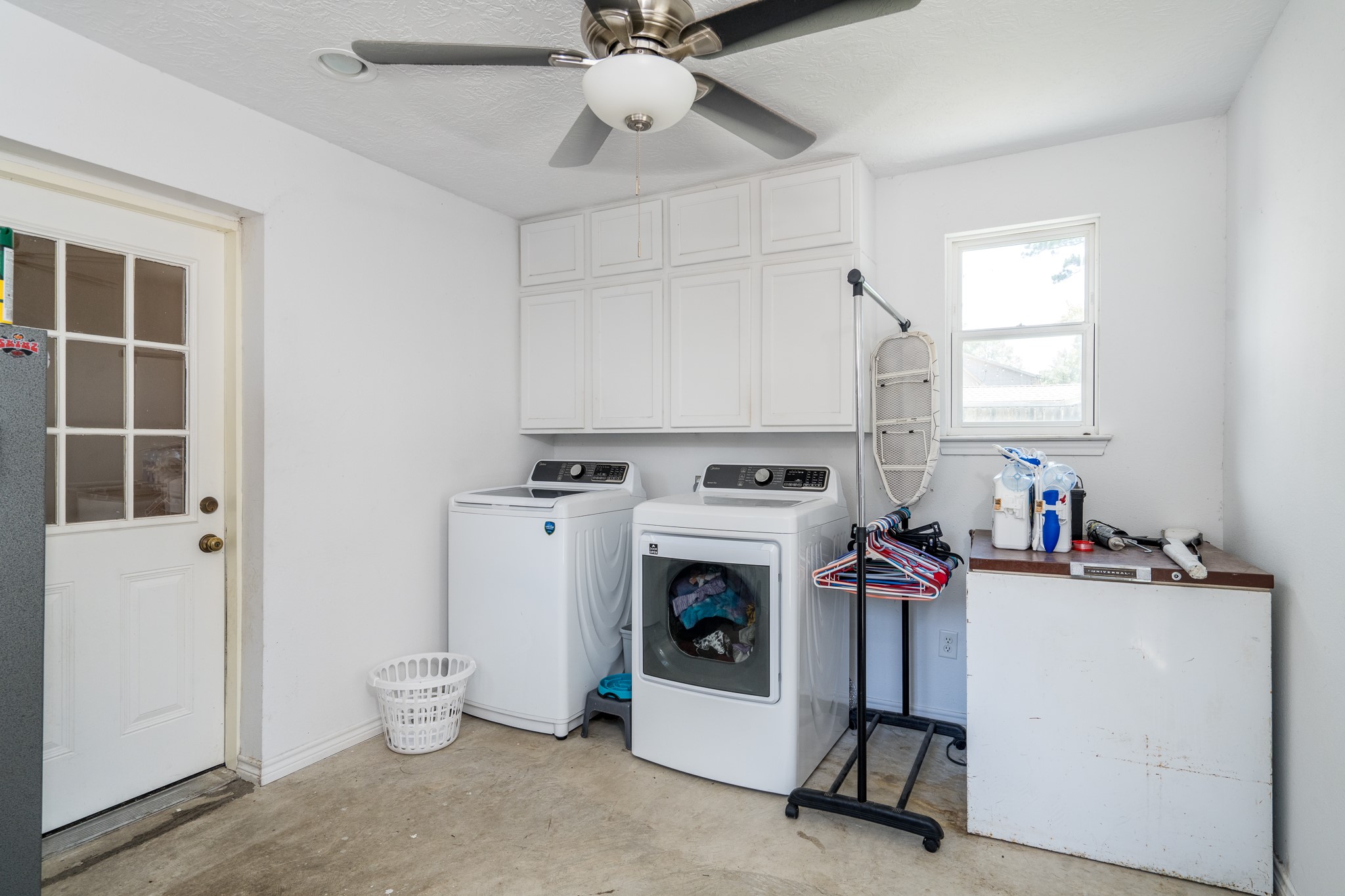 6527 Castle Pine Lane Spring, TX 77379 - Photo 26 of 47 The conveniently located utility area serves both the main home and the attached apartment, adding practicality and ease to everyday living.