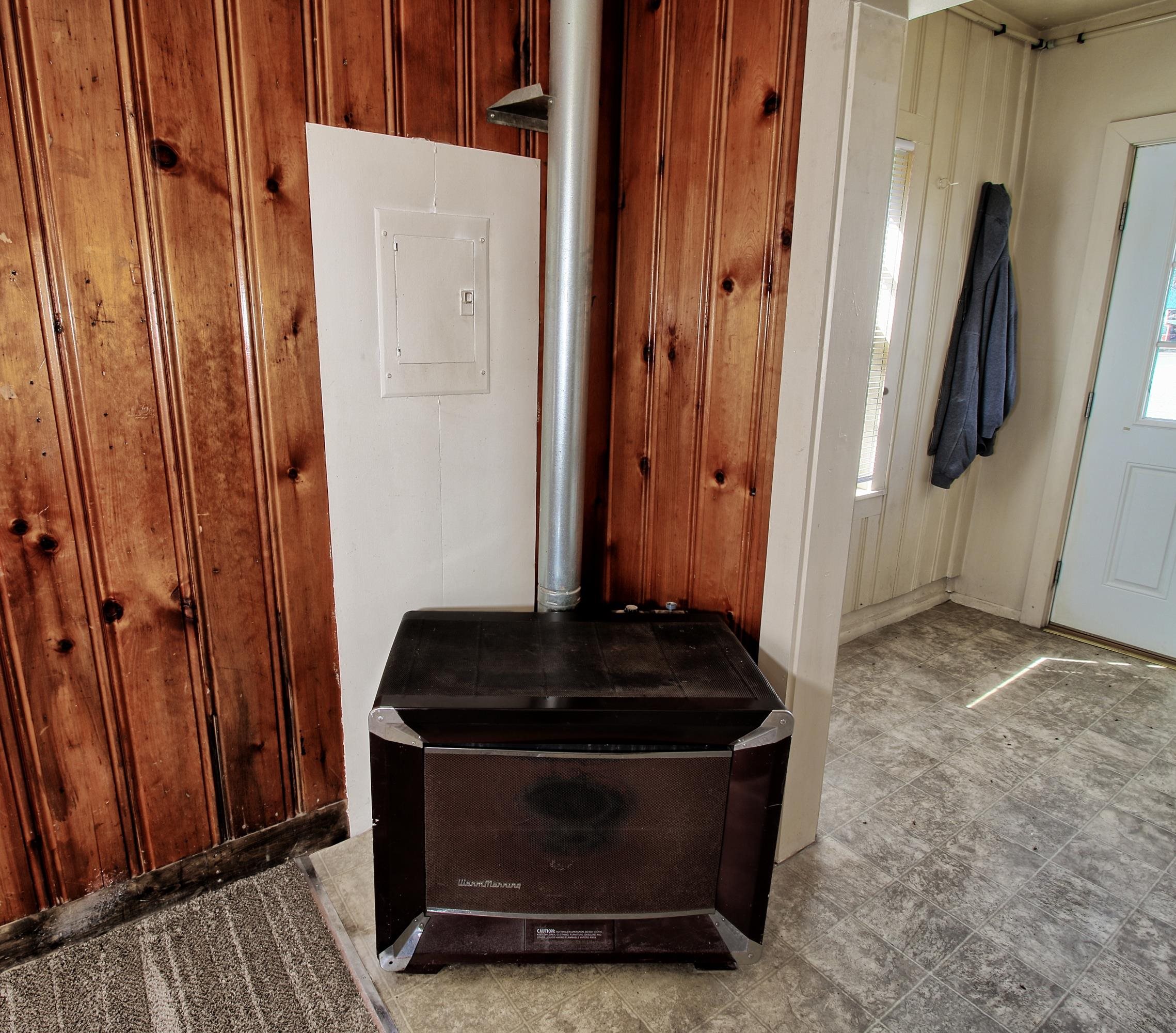 1002 Elm Avenue, Unit B Collbran, CO 81624 - Photo 11 of 17 storage and utility room with wooden floor