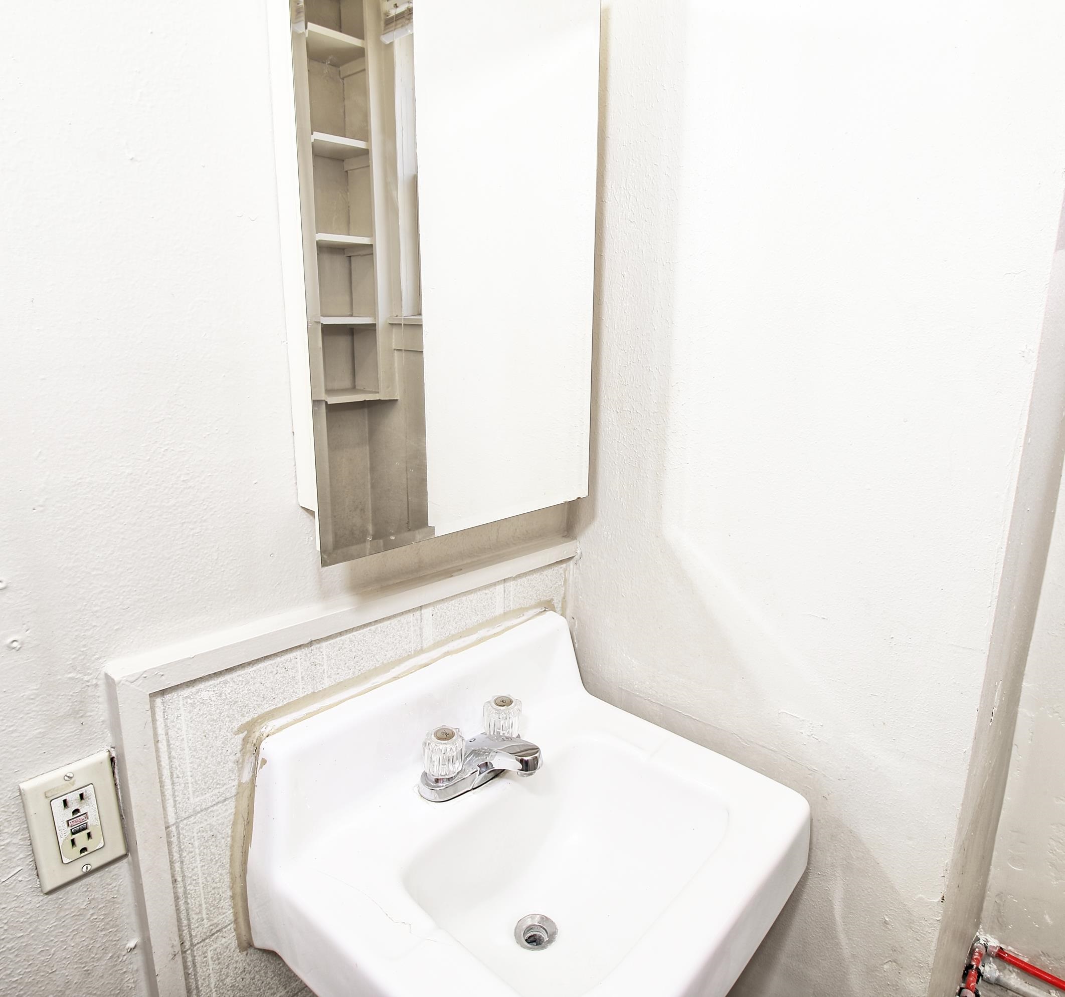 1002 Elm Avenue, Unit B Collbran, CO 81624 - Photo 16 of 17 a bathroom with a sink and a mirror